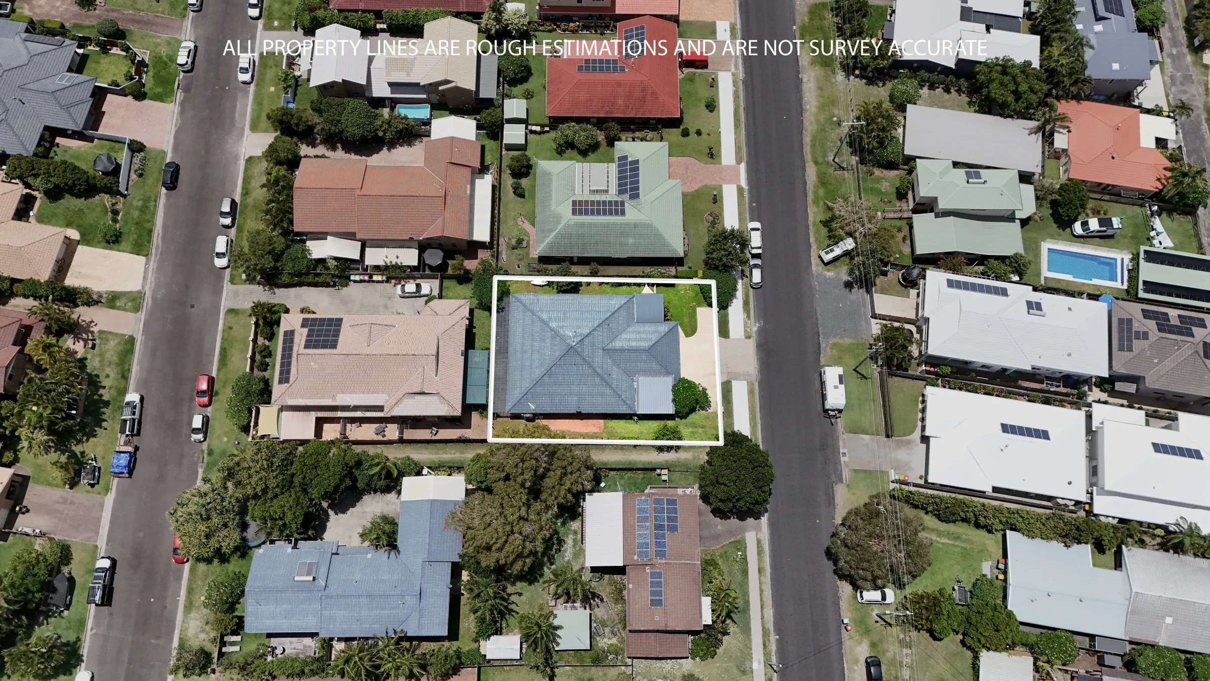 Drone view straight down over a property and its street, by Kris Cook