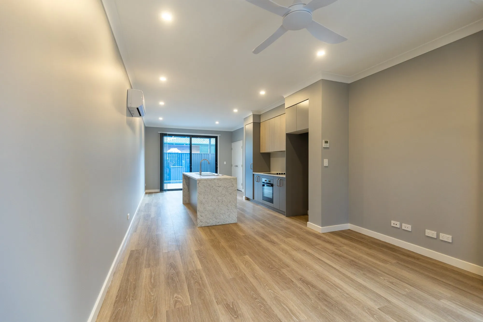 Open-plan living room and kitchen of a Northern Rivers listing, photographed by Kris Cook